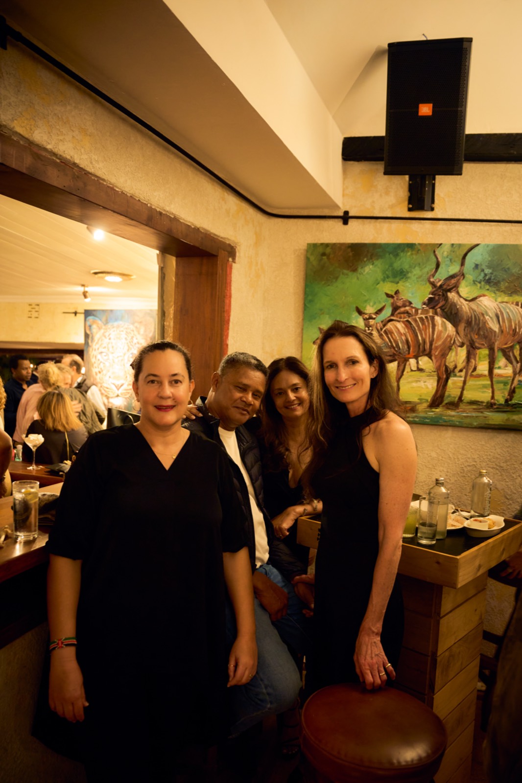 Guests in front of a painting at Talisman