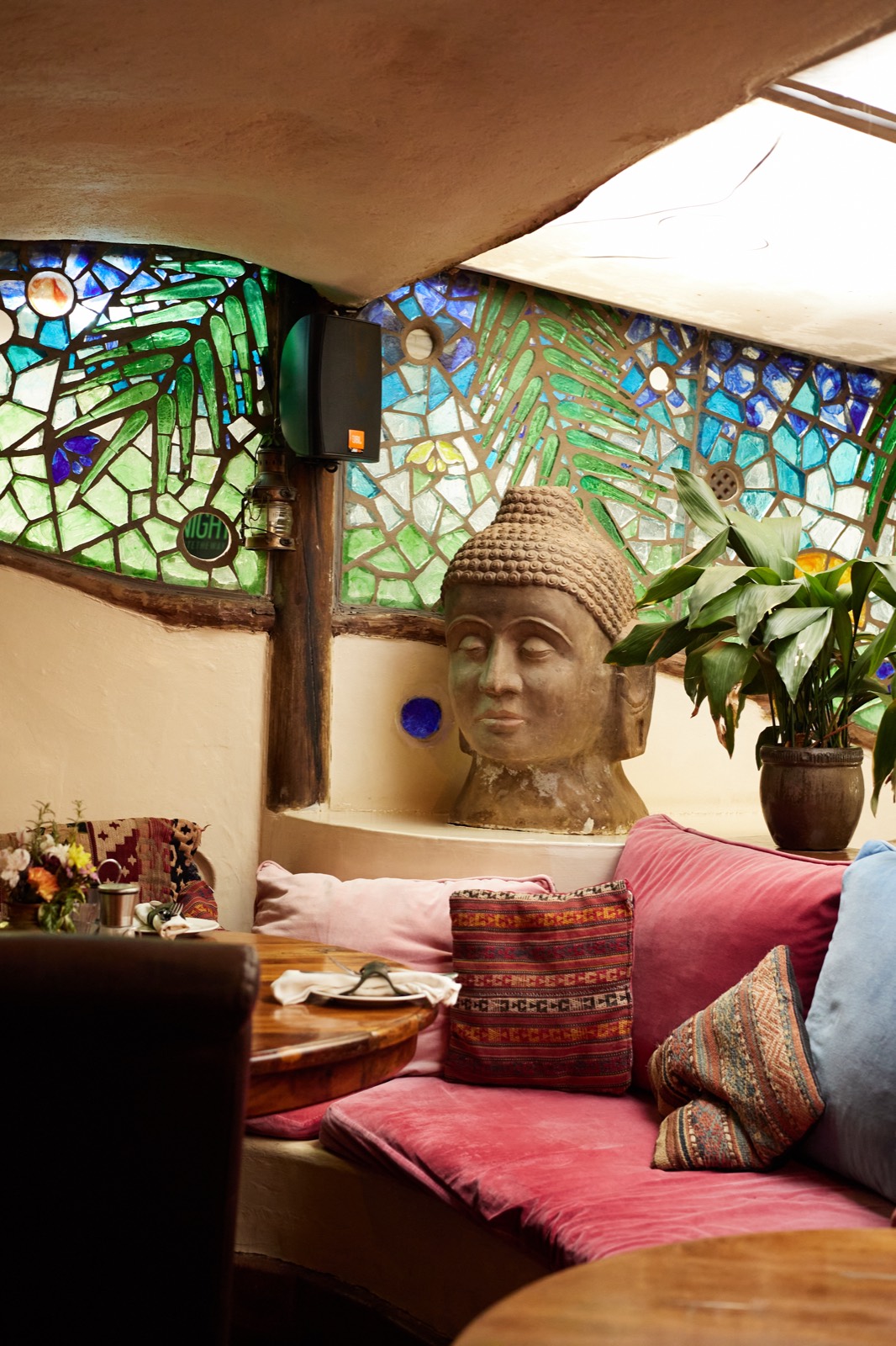 Carved pillars, stained glass and collected pieces in the dining room