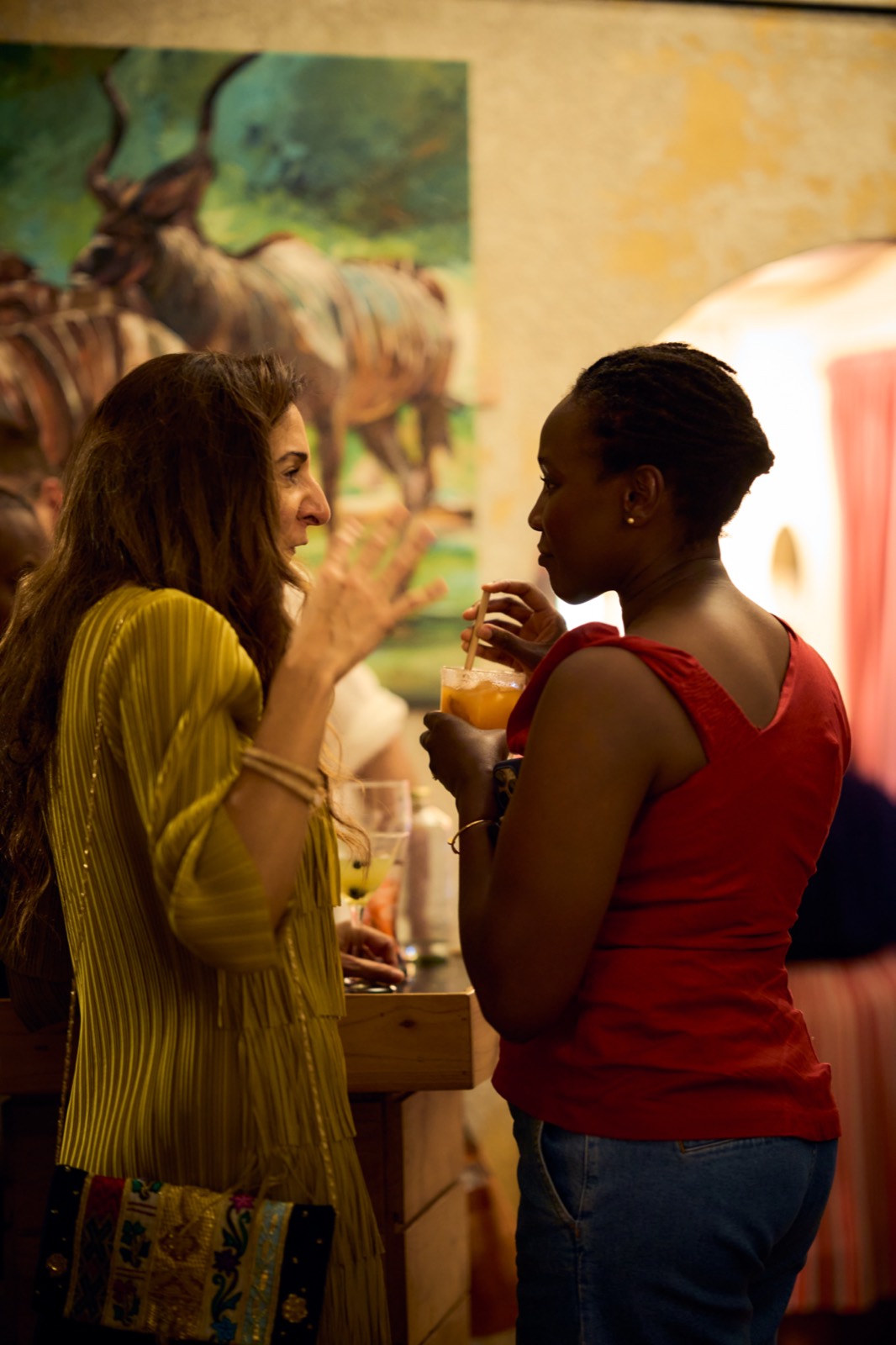 Guests with a glass of wine at the Talisman bar