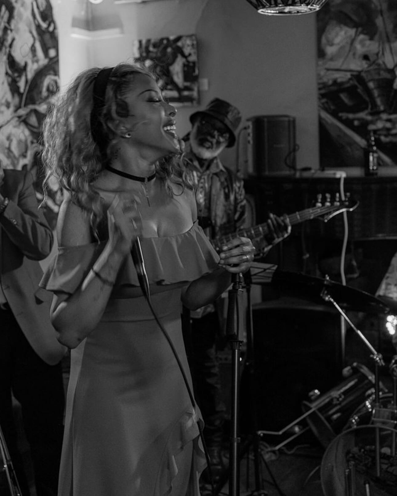 A vocalist performing with the band at Talisman