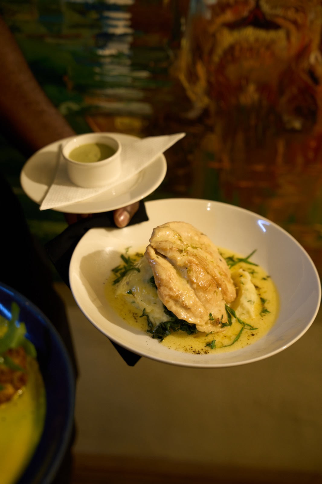 A finished dish, plated and ready to leave the pass